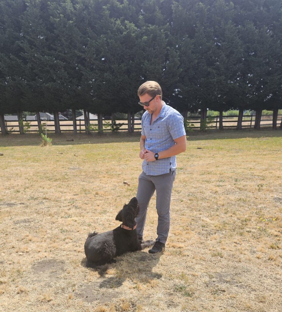 Cameron training a dog with Insight K9 Solutions in the Tri-Cities, Washington
